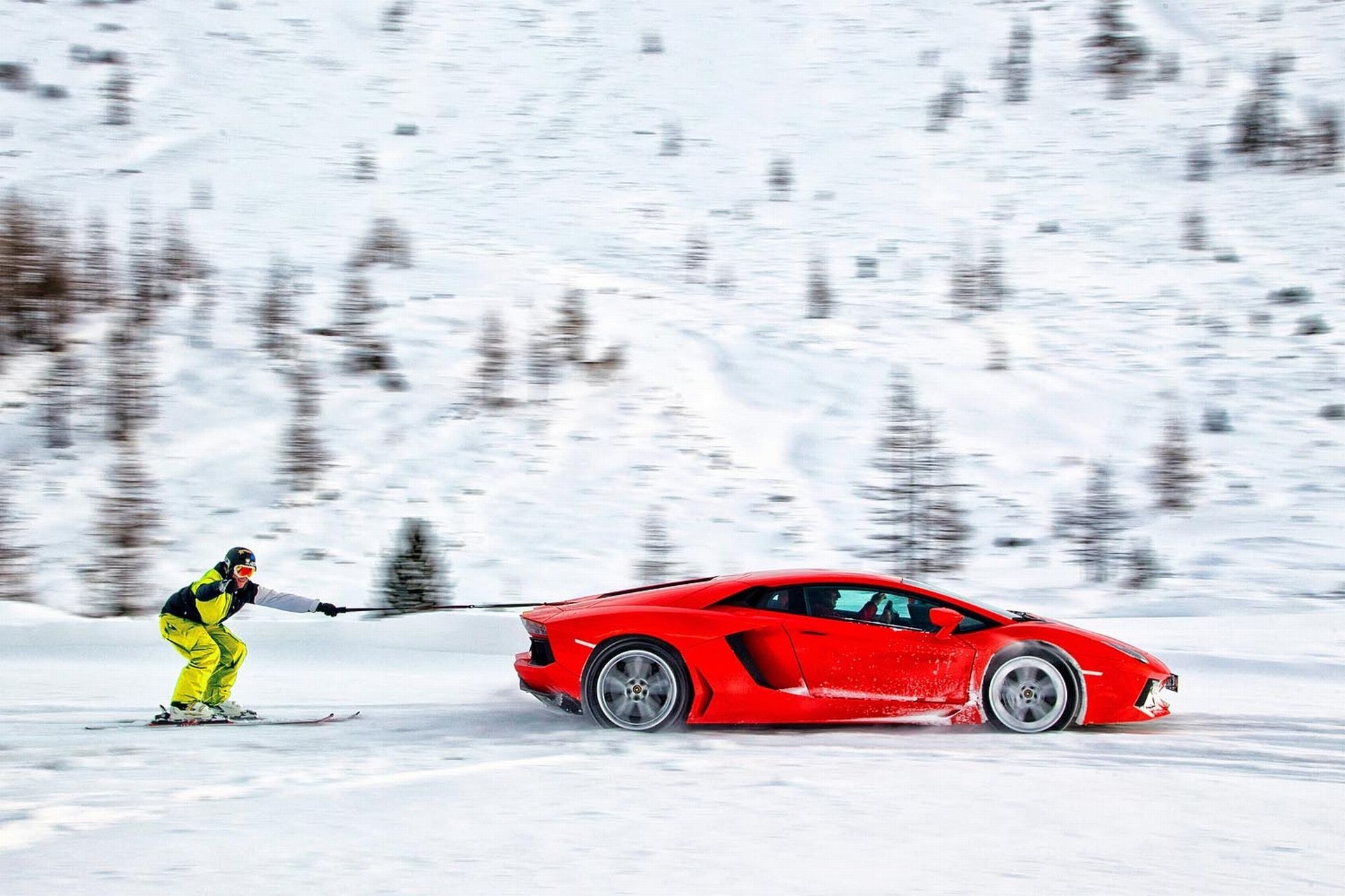 Skier pulling a sports car