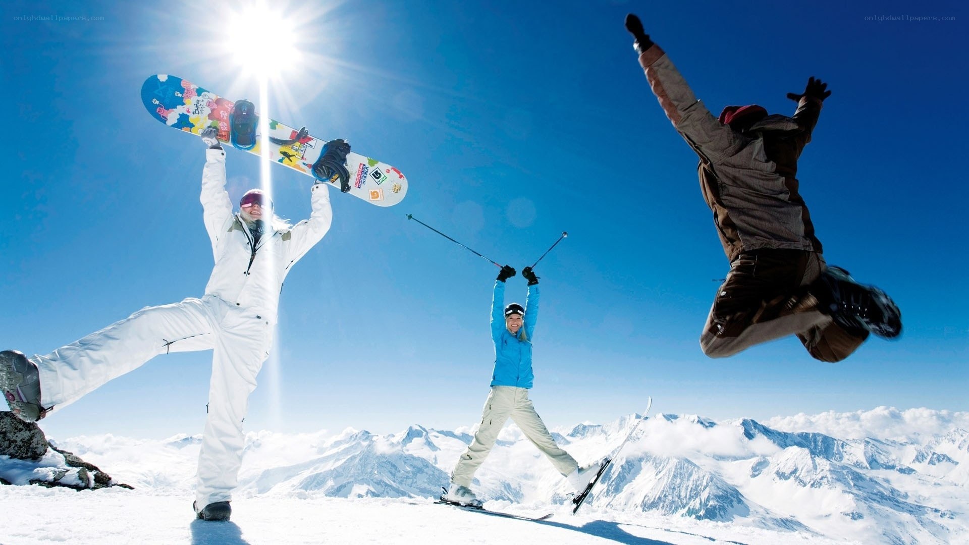 Skiers and snowboarders celebrating