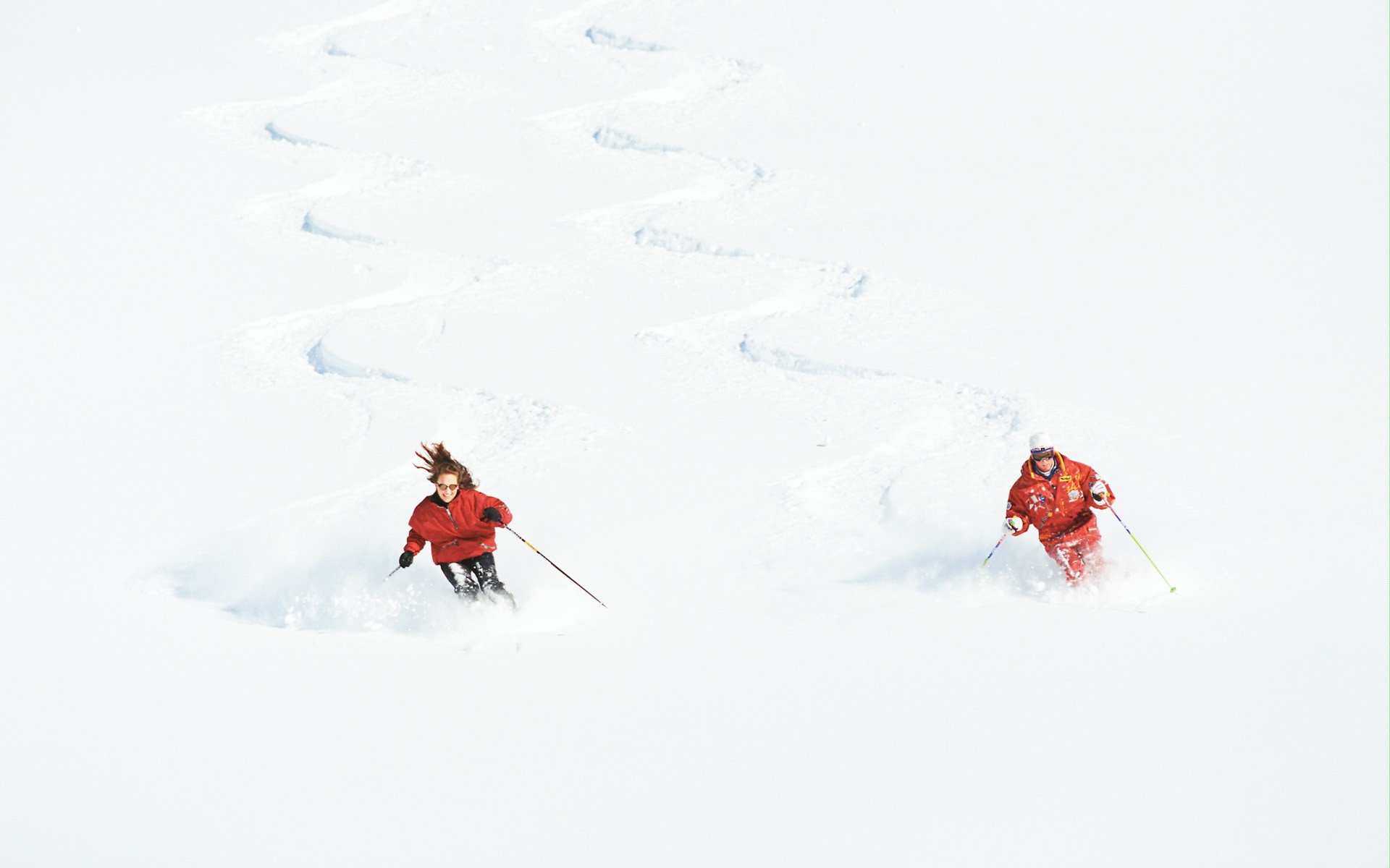 Skiers in deep snow