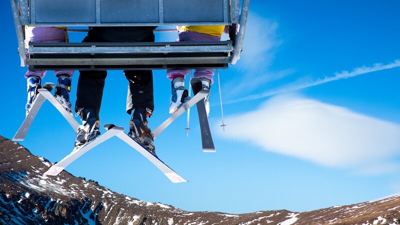 Skiers on a chairlift