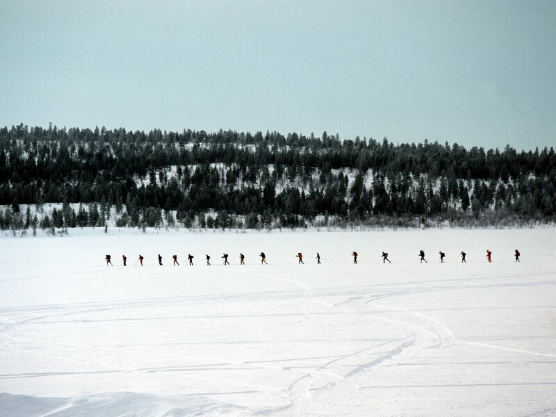 Skiers on a frozen lake