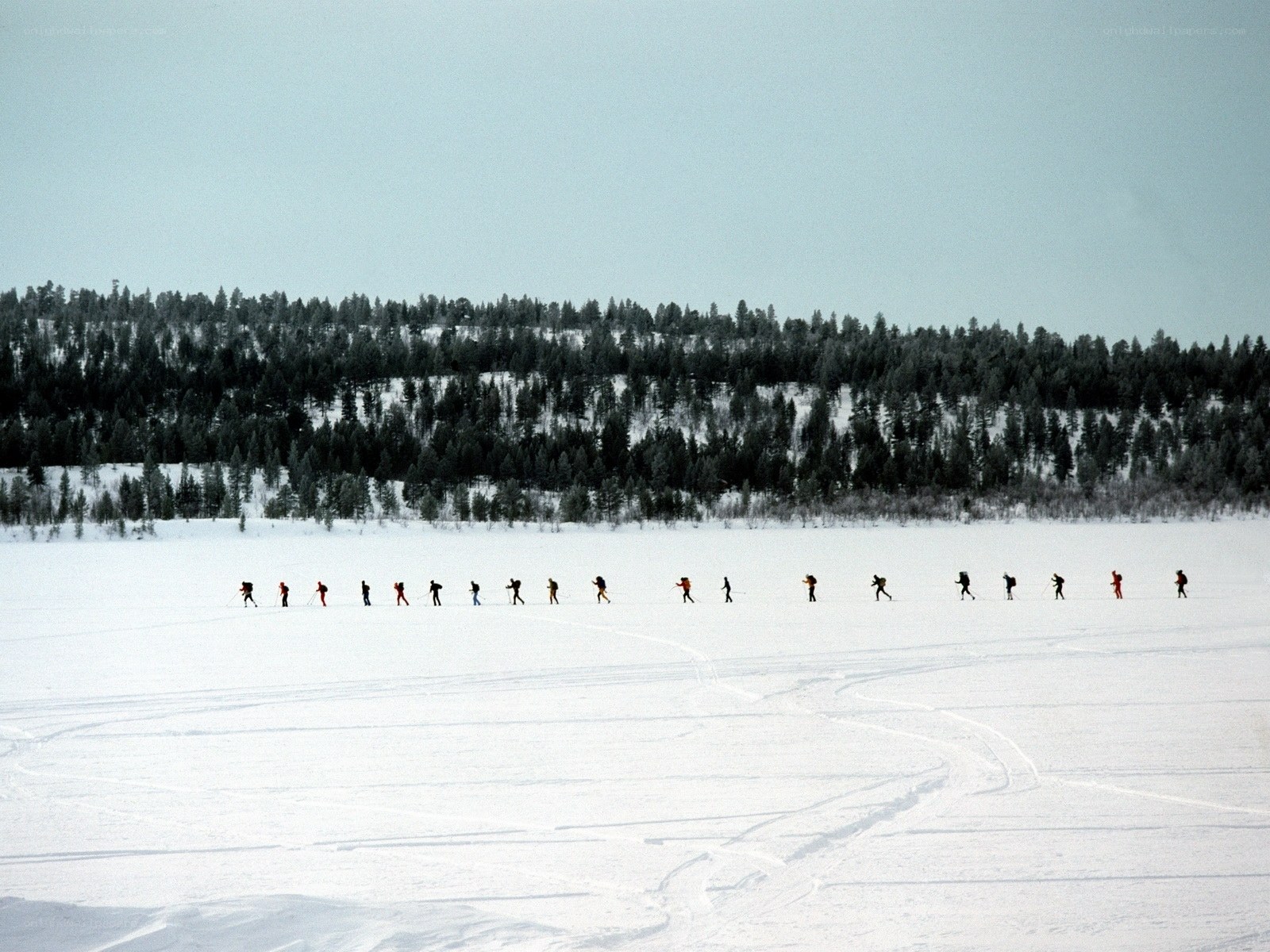 Skiers on a frozen lake