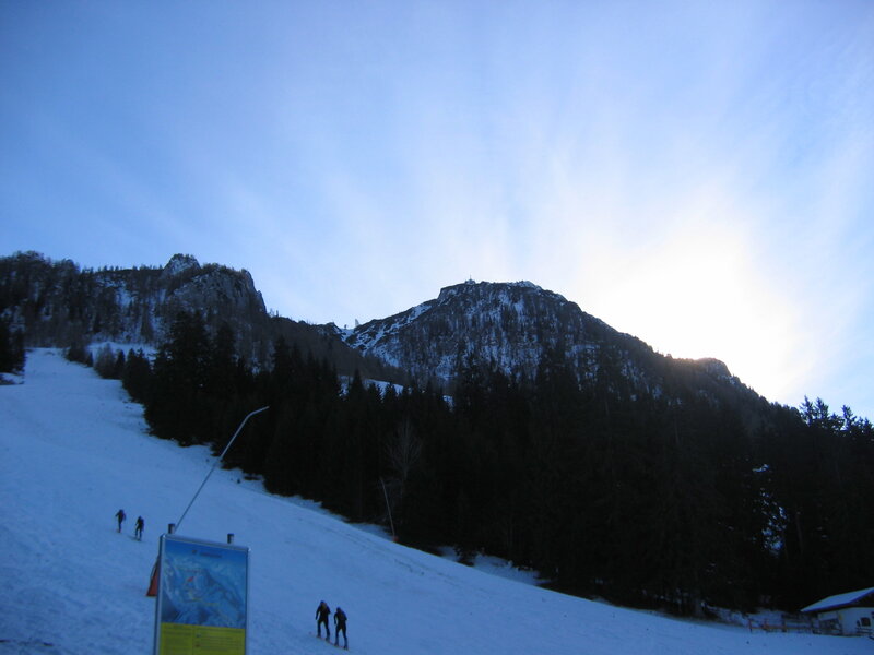 Skiers on a snowy mountain slope