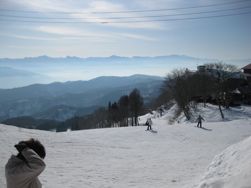 Skiers on a snowy mountain slope