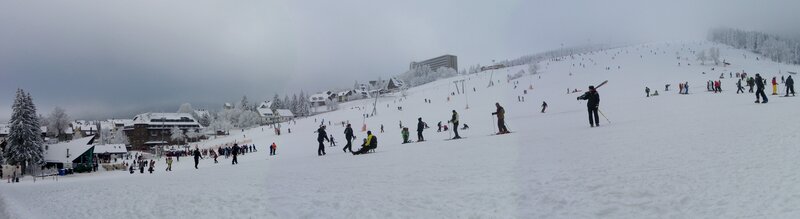 Skiers on a snowy mountain slope