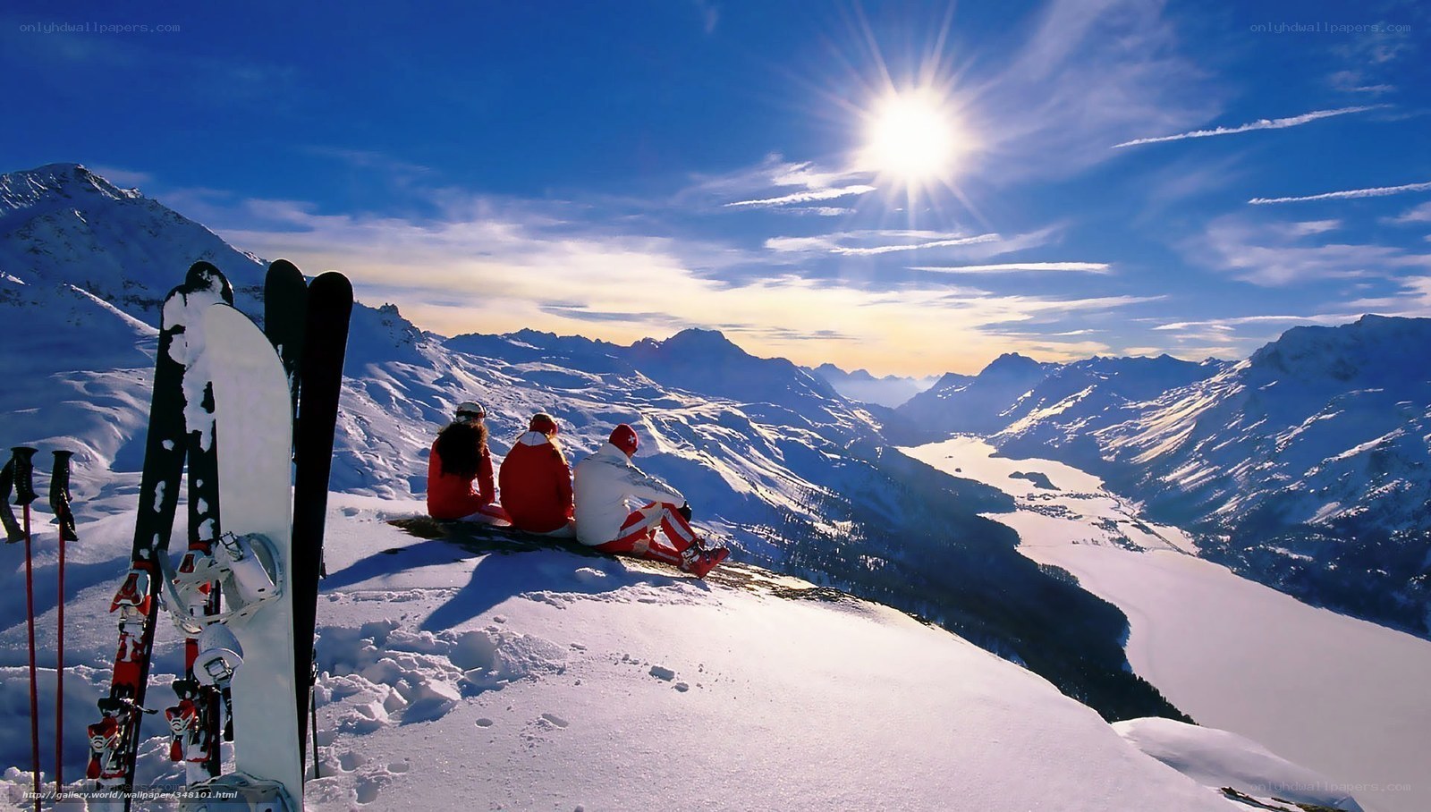 Skiers on snowy mountain peak