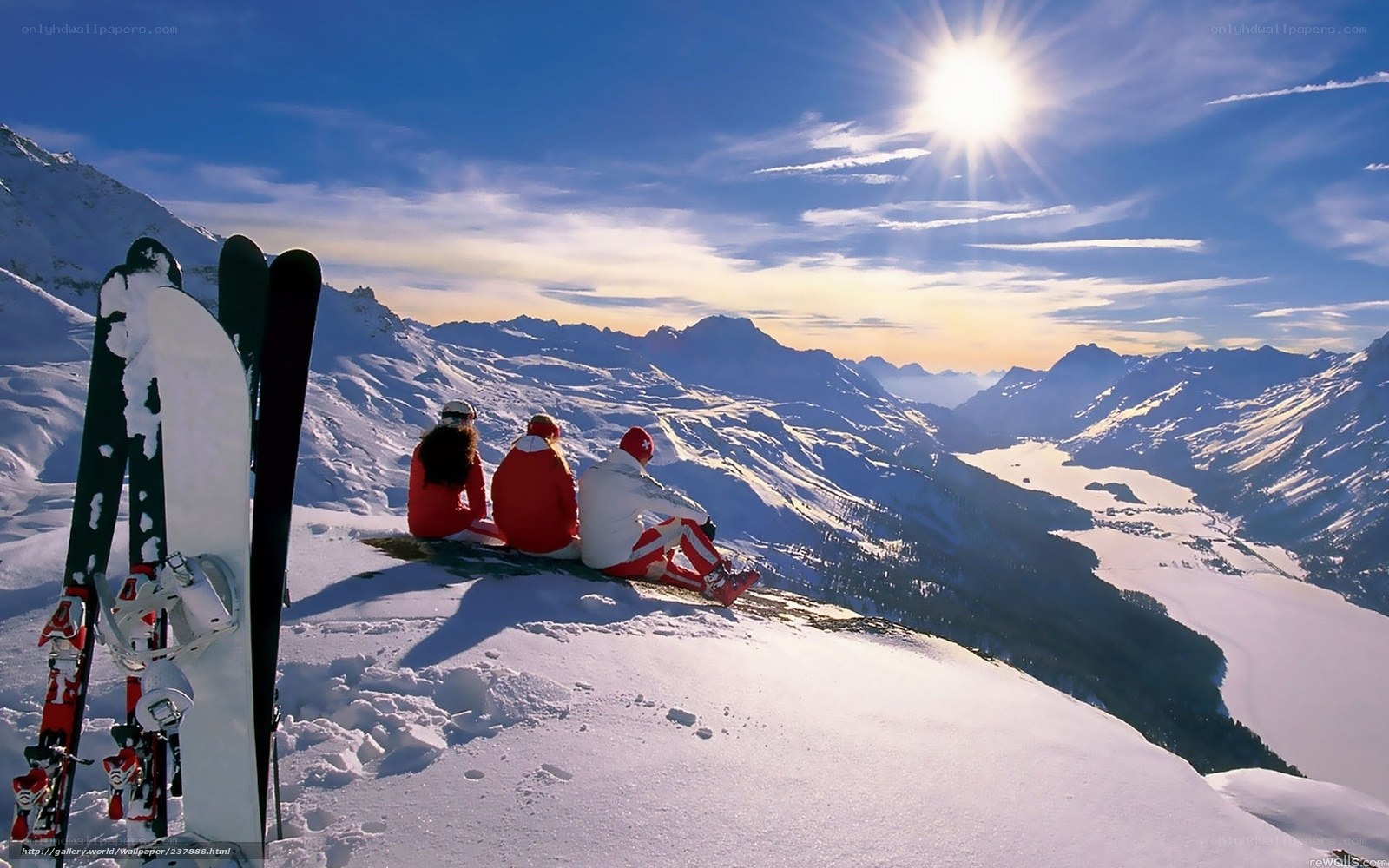 Skiers on snowy mountain peak