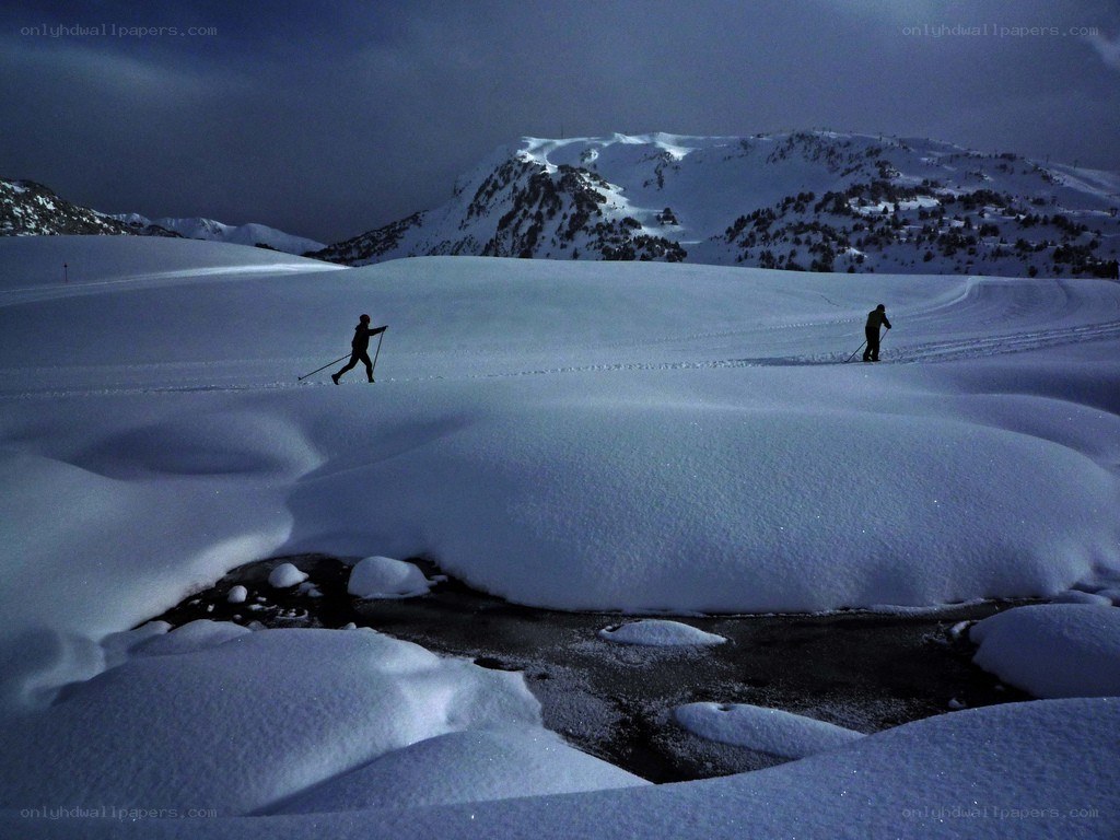 Skiers on snowy mountain