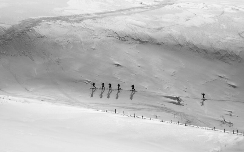 Skiers on Snowy Slope — Black