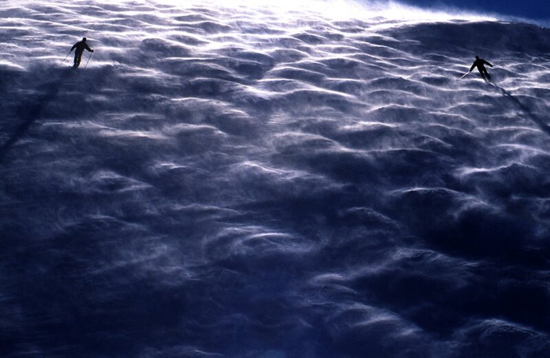 Skiers on Snowy Slope — Blue, Dramatic