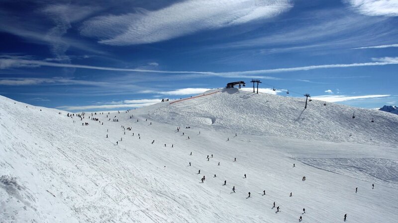 Skiers on Snowy Slope — White, Bright