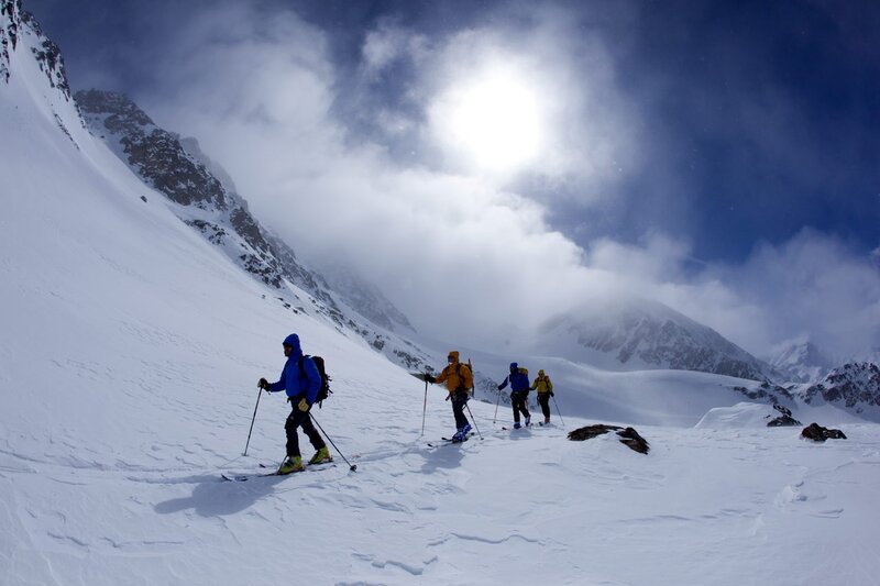 Skiers on Snowy Slope — White, Dramatic