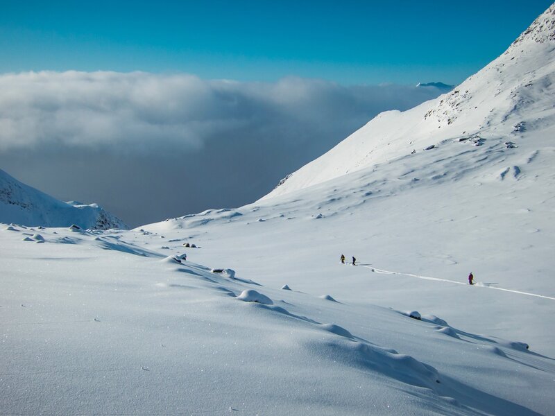 Skiers on Snowy Slope — White, Serene, Winter, Photograph, Mountain