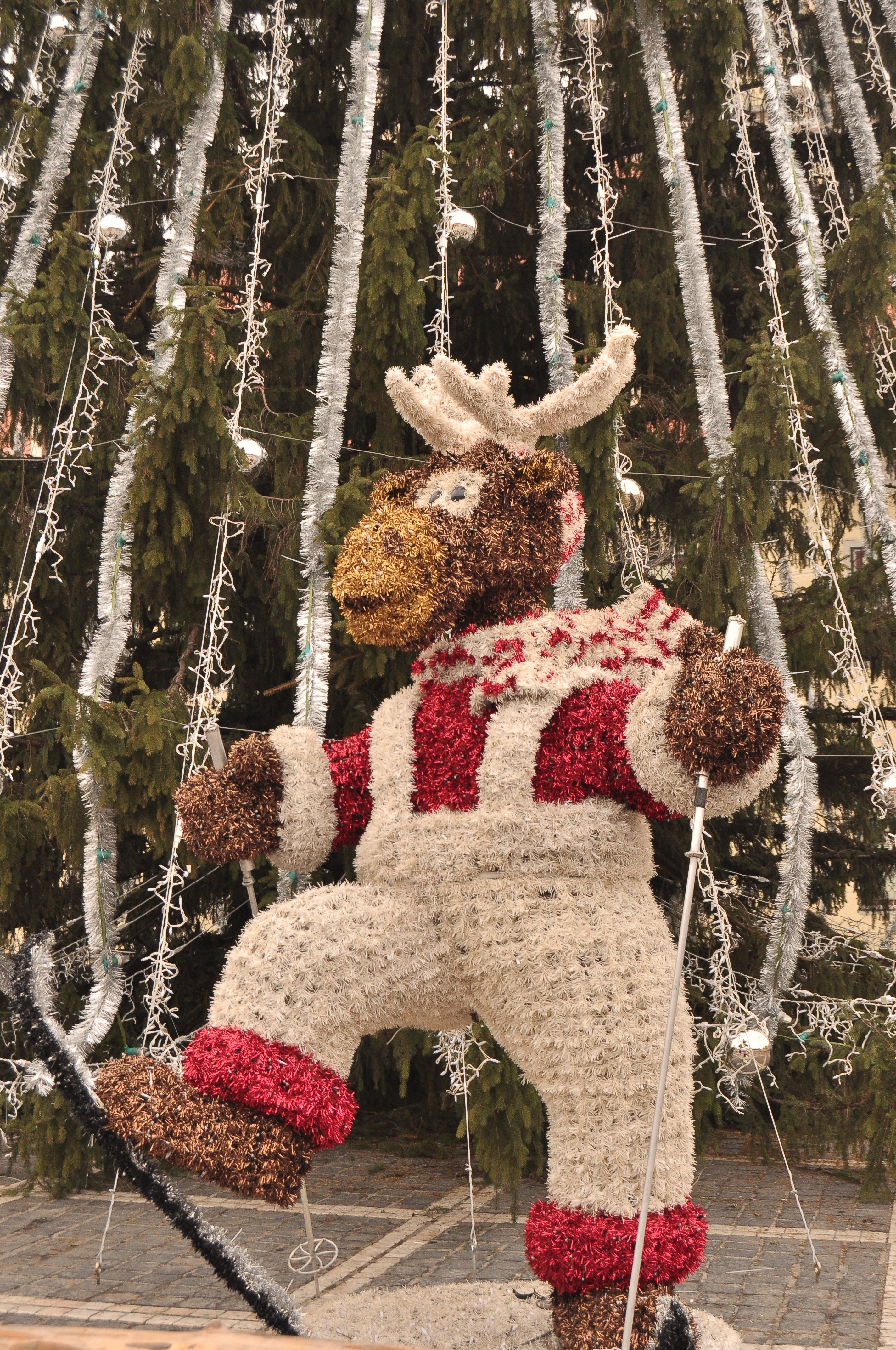 Skiing reindeer sculpture