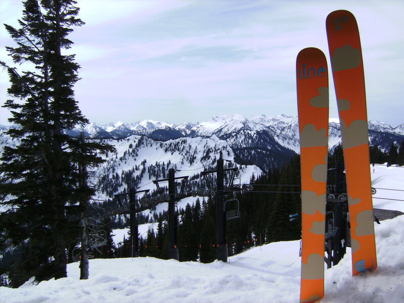 Skis on snowy mountain slope