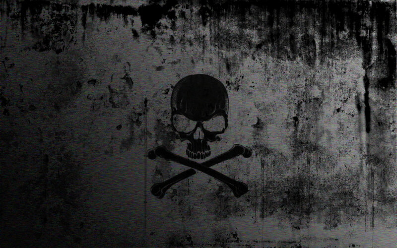 skull and crossbones on grungy wall