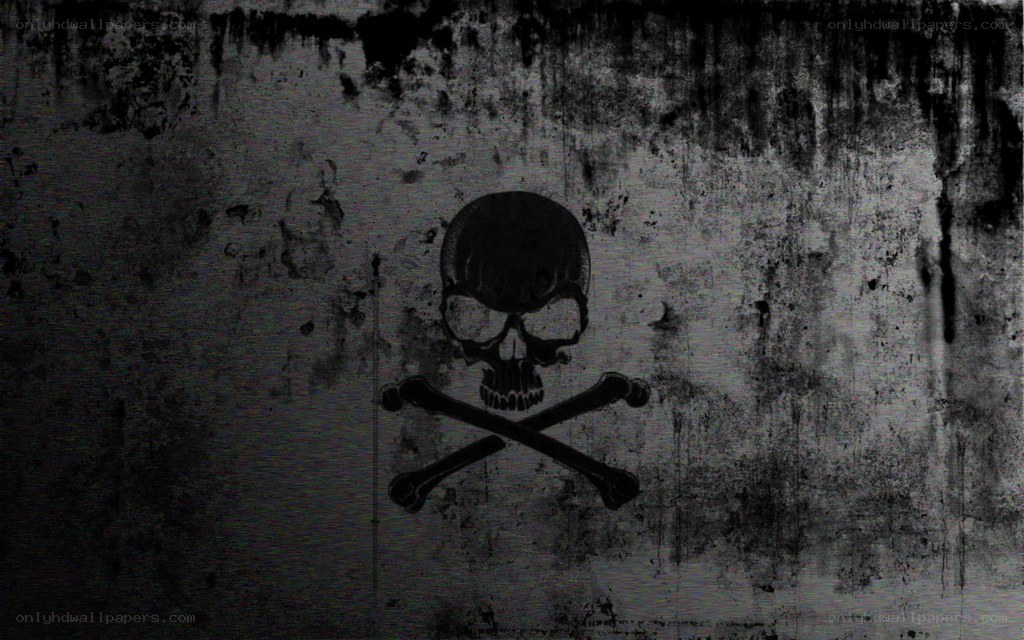 skull and crossbones on grungy wall