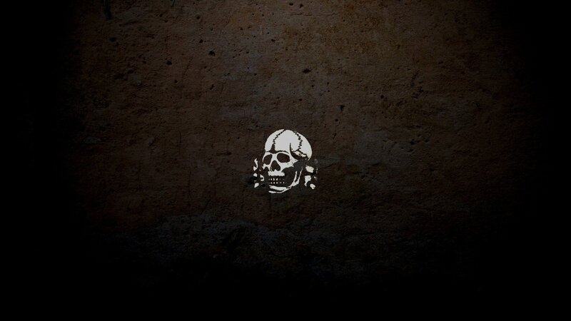 skull graffiti on concrete wall