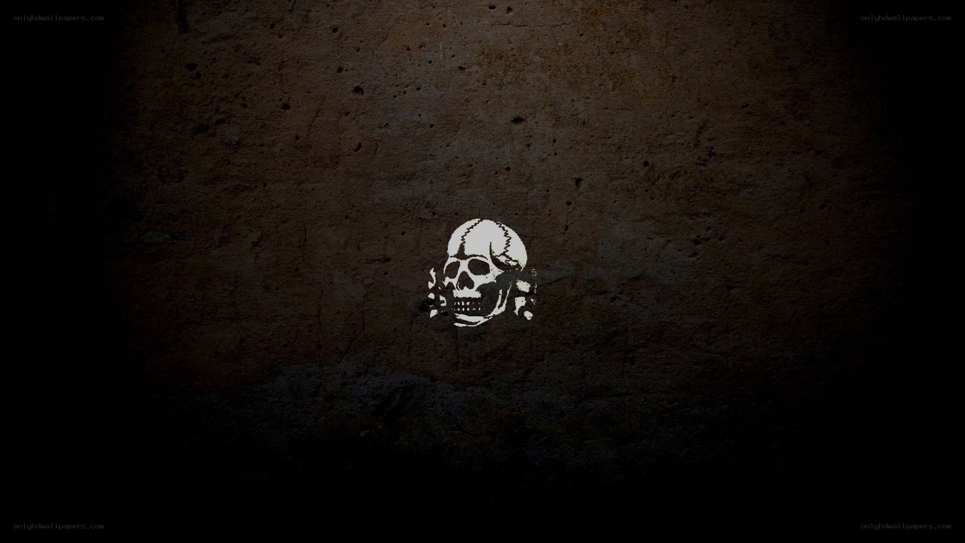 skull graffiti on concrete wall
