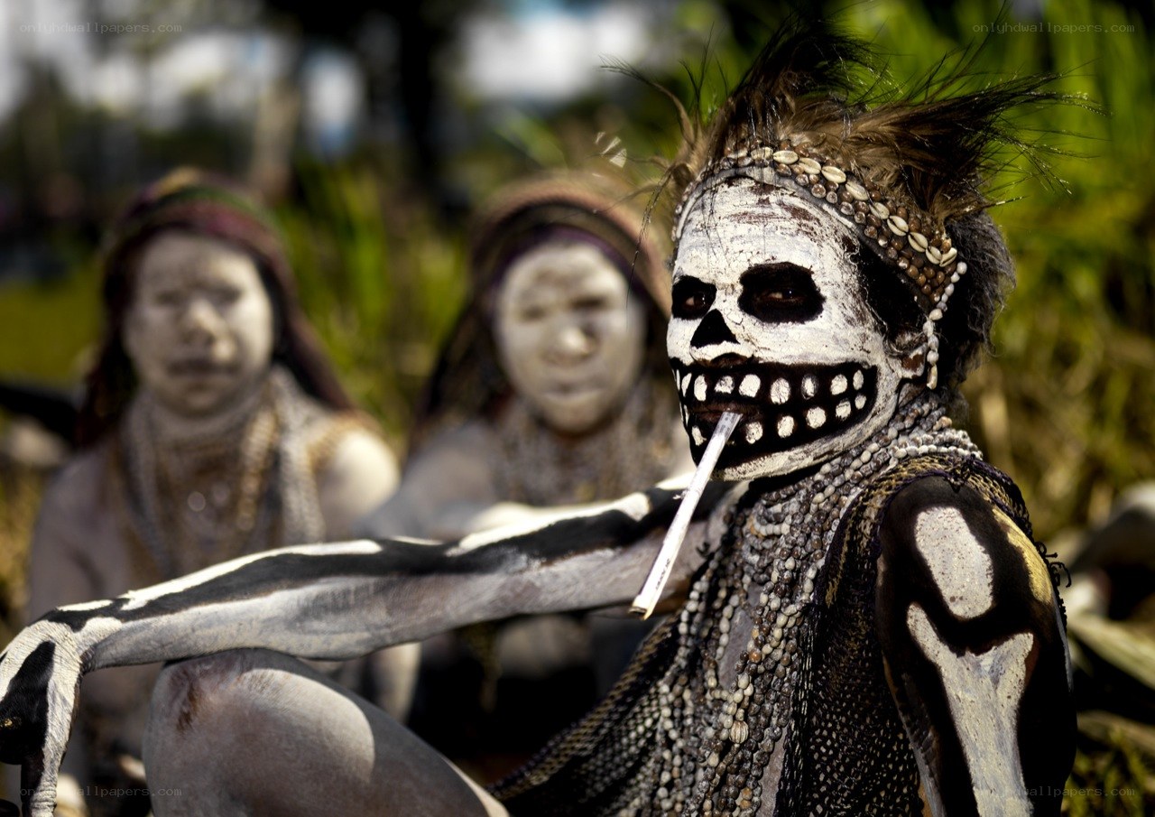Skull-painted tribal performers