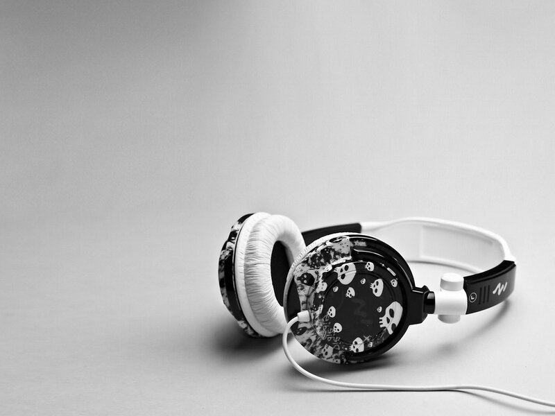 Skull-patterned headphones on gray