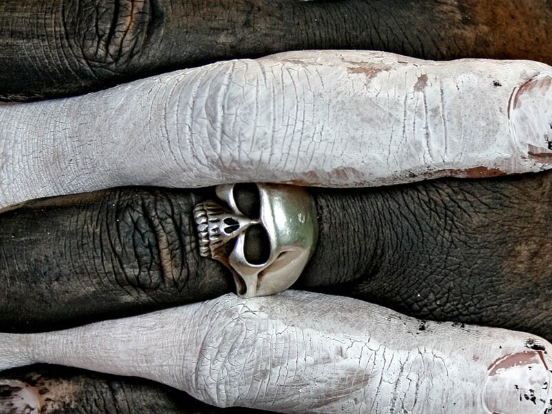 Skull ring on painted hand