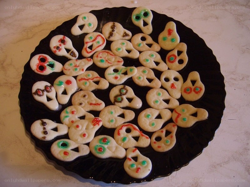 skull-shaped cookies on a plate