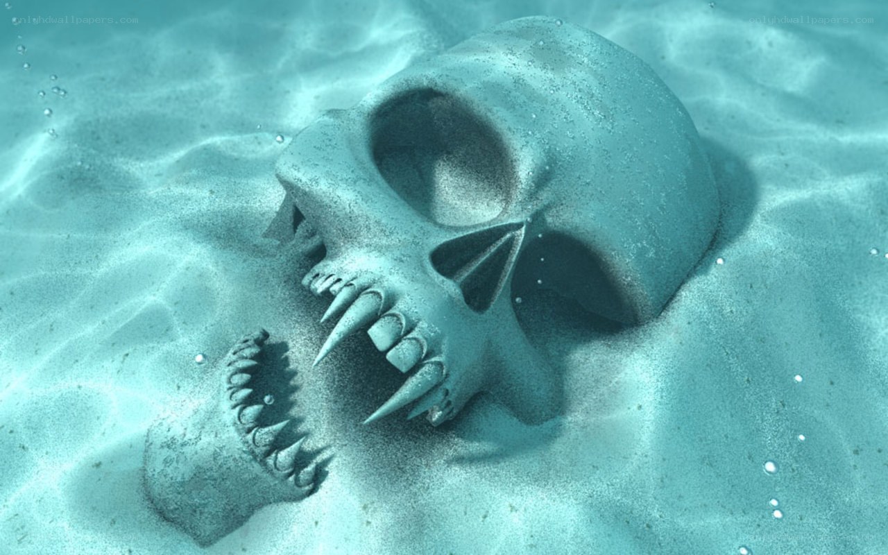 skull underwater on sand