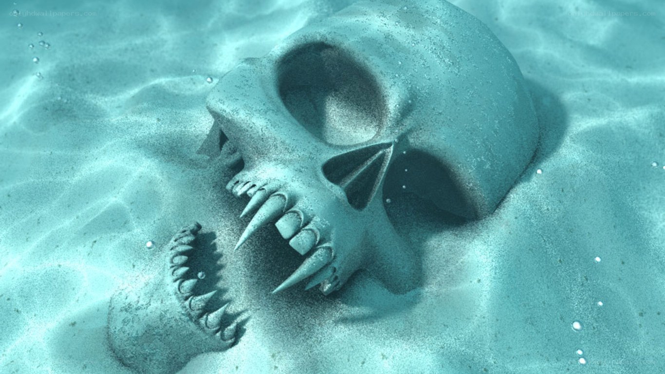 skull underwater on sandy seabed