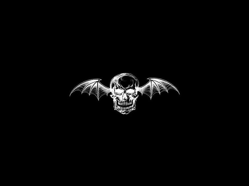 skull with bat wings logo