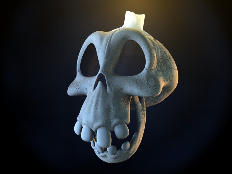 skull with candle on top