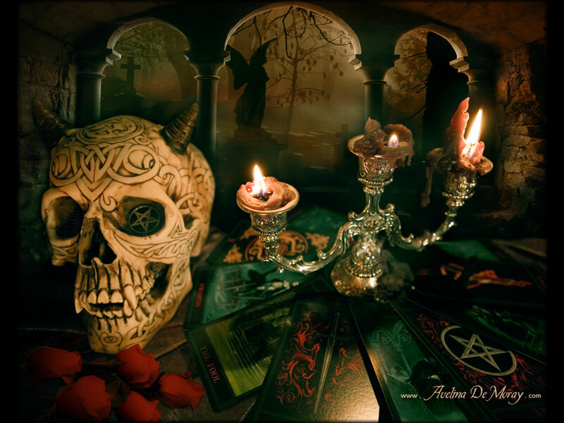 Skull with candles and tarot cards
