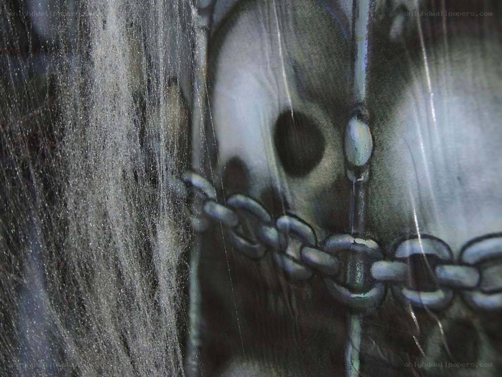 skull with chains and cobwebs