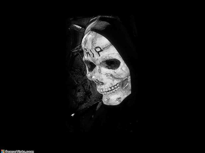 skull with hood and inscription