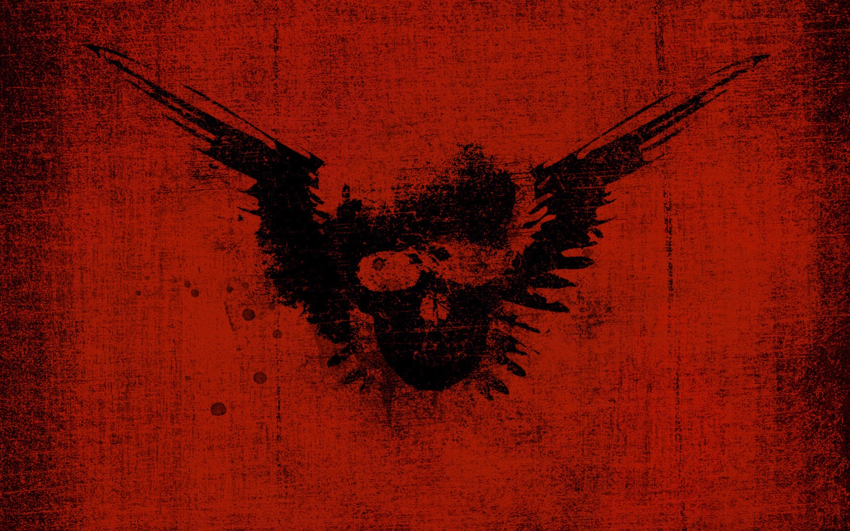 skull with wings on red background