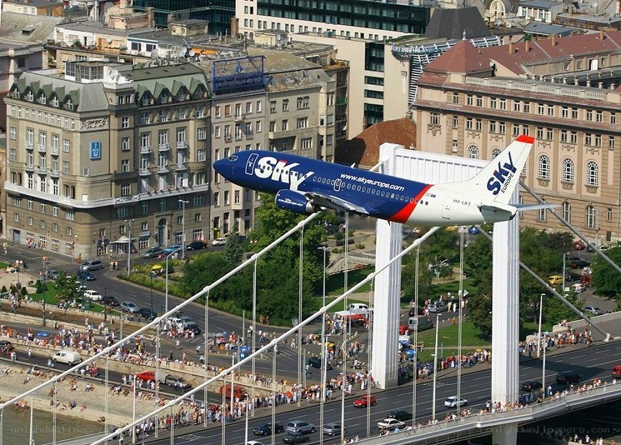Sky Europe plane flying over bridge