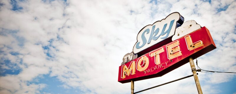 Sky Motel Sign — Blue, Dramatic, Afternoon, Photograph