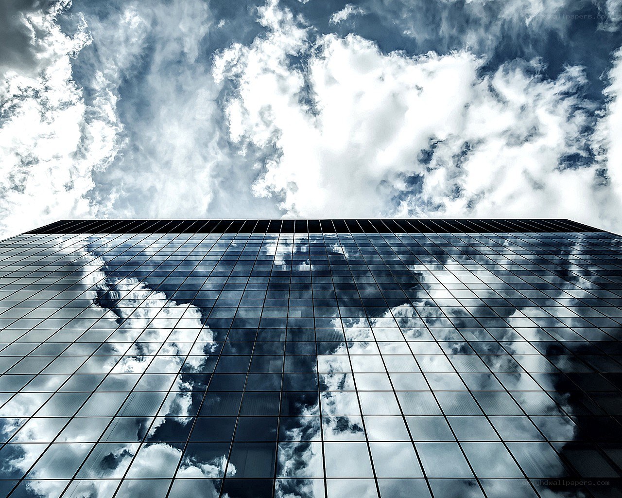 Sky reflected in glass building