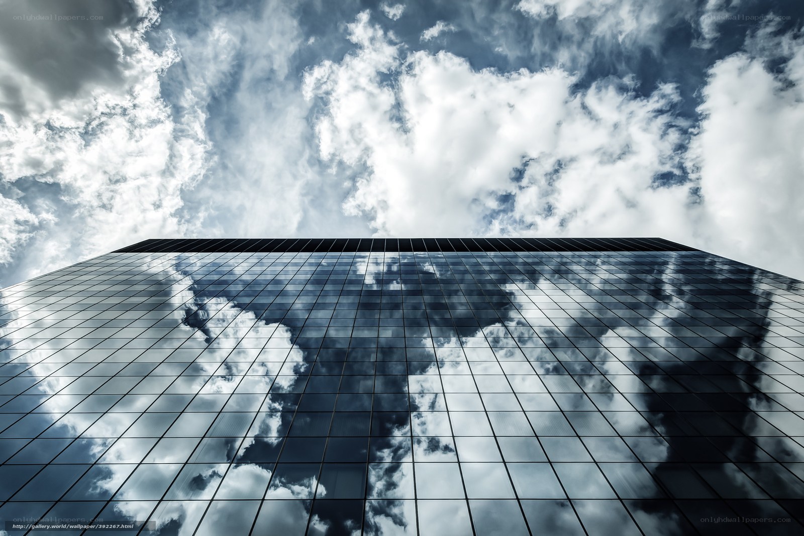 Sky reflected in glass building