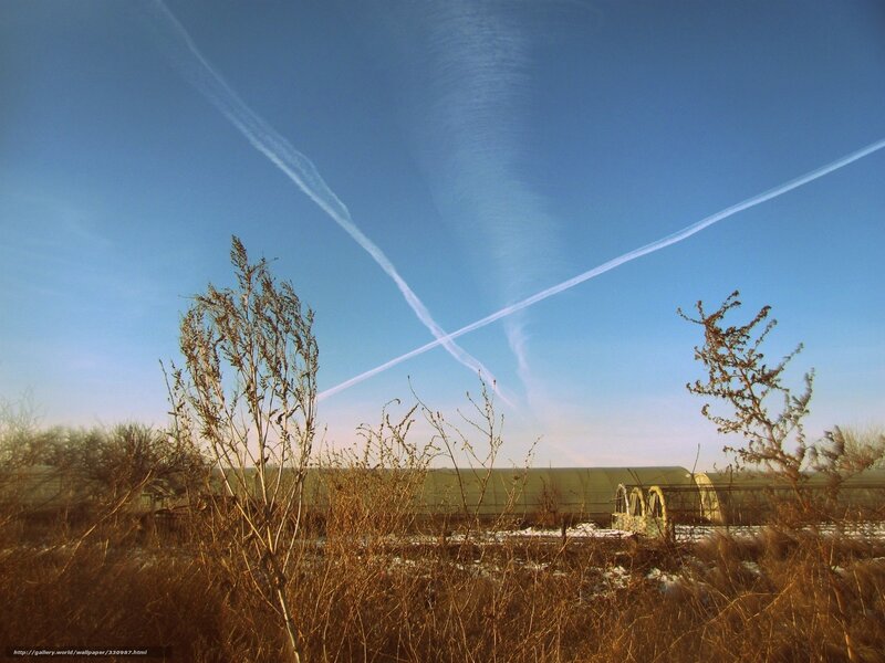 Sky with Contrails and Greenhouses