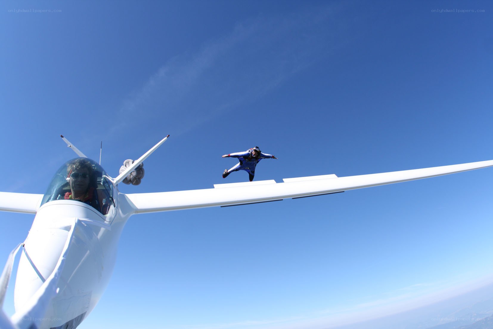 Skydiver jumping from glider