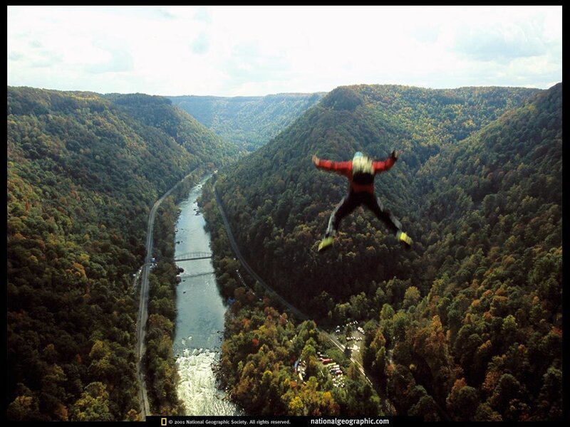 Skydiver over a river valley