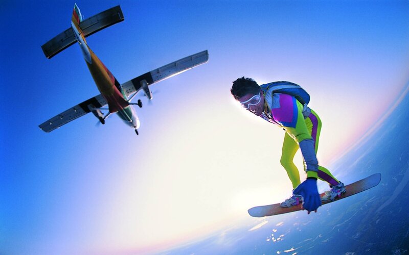 skydiver with snowboard