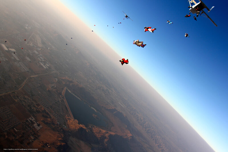 Skydivers above the landscape