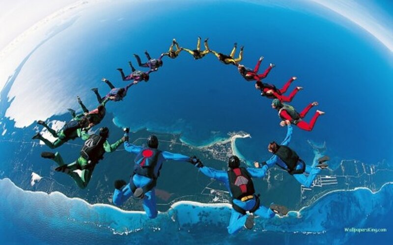 Skydivers Forming Circle — Blue