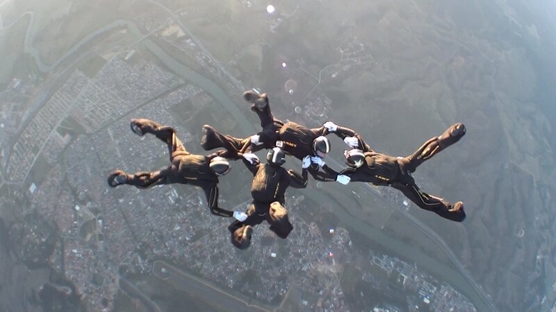 Skydivers in Formation — Black, Dramatic