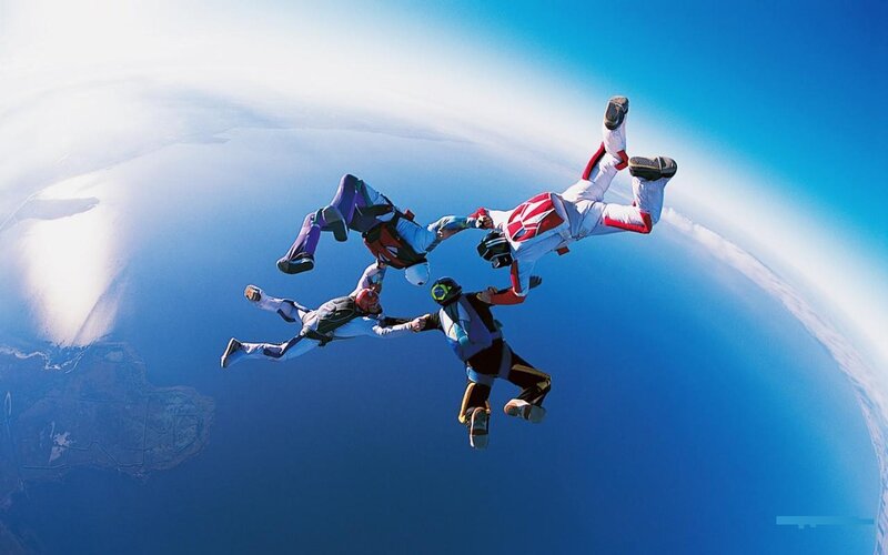 Skydivers in Formation — Blue, Dramatic, Afternoon, Photograph, Sky, Clouds