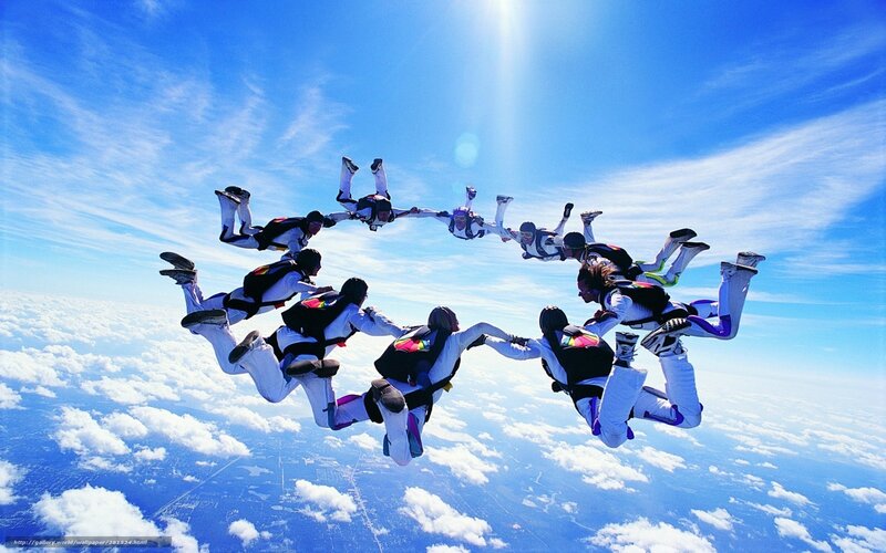 Skydivers in Formation — Blue, Dramatic, Afternoon, Photograph