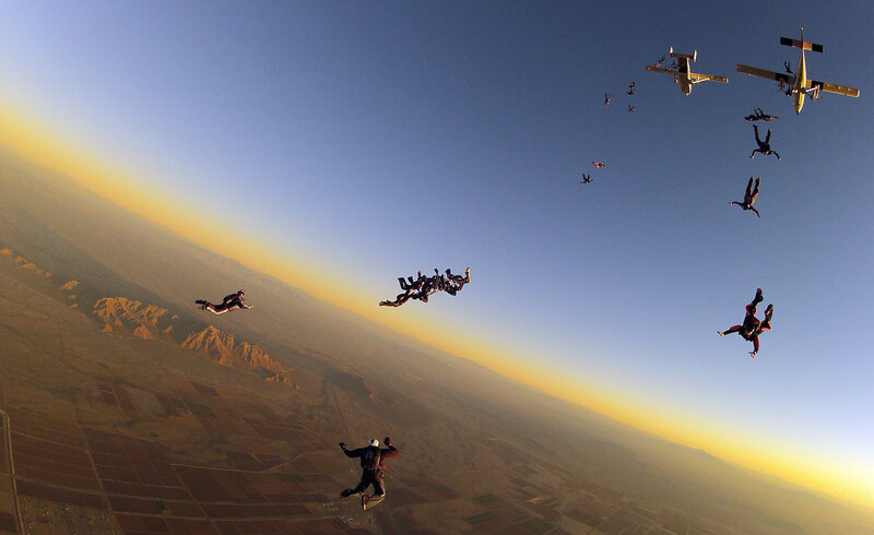 Skydivers in Formation — Blue, Dramatic
