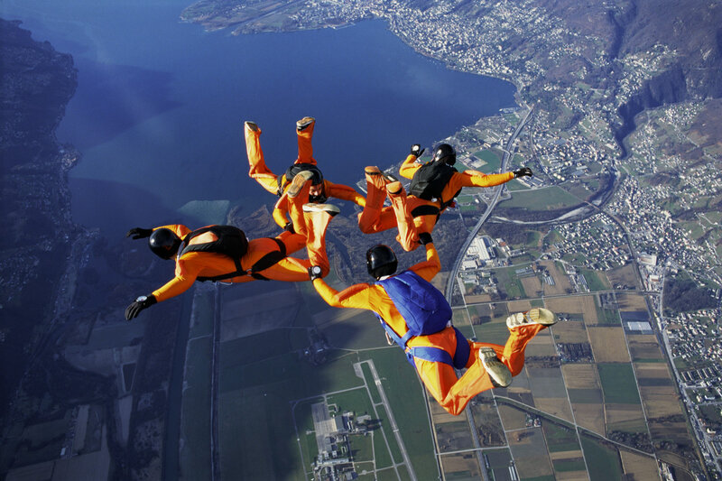 Skydivers in Formation — Orange